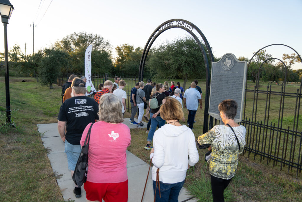 Hops and History guests enter the Old Settlers Cemetery to begin their tour