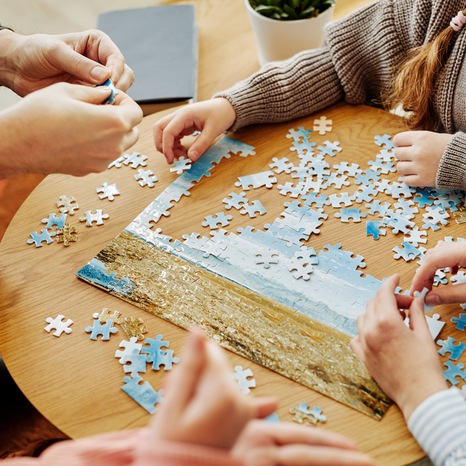 photo of People completing a puzzle